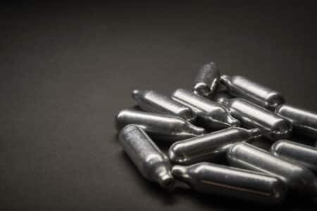 Lawsuits have been filed against Amazon and other makers of nitrous oxide products like Galaxy Gas  without warning of paralysis, nerve damage, or death.  Need a Texas Nitrous Oxide Injury Lawyer? Collen A. Clark is a true advocate for his clients and is passionate about helping Texans that have been injured or wronged. If you were injured or lost a loved one after inhaling flavored nitrous oxide, such as Galaxy Gas or other products, contact our lawyers immediately. You may be entitled to compensation by filing a lawsuit. Amazon Linked to Galaxy Gas and Flavored Nitrous Oxide Lawsuits In February 2026, a group of injured consumers filed suit against Amazon and more than a dozen nitrous oxide manufacturers in King County Superior Court in Washington. The case, Finnegan v. Amazon.com Services LLC (Case No. 26-2-05235-2), names brands including Galaxy Gas, Baking Bad, Cosmic Gas, Miami Magic, ExoticWhip, FastGas, HOTWHIP, and MassGass. The complaint alleges that Amazon and the manufacturers sold large, candy-flavored canisters of nitrous oxide they knew would be inhaled recreationally, while using a "culinary use" label to sidestep the rules that limit medical-grade nitrous oxide. It claims a single six-pack of 2,000-gram canisters holds enough gas to charge more than 1,400 whipped cream dispensers, far more than any real kitchen would need. The plaintiffs bring claims for failure to warn, negligence, breach of implied warranty, design defect, and unfair or deceptive trade practices, and they are seeking compensatory and punitive damages. What Is the Danger of Flavored Nitrous Oxide? Nitrous oxide, known as "whippets" or "whip-its," is a colorless gas used safely in medicine and dentistry, where it is mixed with oxygen and given through a mask. Traditional whipped cream chargers hold only about 8 to 16 grams. The products in these lawsuits are sold in canisters holding up to 2,000 grams of pure nitrous oxide, in flavors like watermelon and strawberry, in bright packaging that critics say appeals to teens and young adults. When inhaled in pure form without oxygen, nitrous oxide starves the brain of oxygen and inactivates vitamin B12. Over time, this is linked to nerve and spinal cord damage. The FDA warns that misuse is linked to a long list of serious health problems, described in its own words below. "Inhaling nitrous oxide can result in a range of symptoms and serious health problems, from abnormal blood counts, asphyxiation, blood clots, frostbite, headache, impaired bowel and bladder function, lightheadedness, limb weakness, loss of consciousness, numbness, palpitations, paralysis, psychiatric disturbances (delusions, hallucinations, paranoia, depression), tingling, trouble walking, vitamin B12 deficiency, and in some cases, death." What Are the Symptoms of Nitrous Oxide Injury? Nerve damage from nitrous oxide can build slowly, so many users do not connect their symptoms to the gas. If you used flavored nitrous oxide heavily and then noticed any of the following, your experience may match what doctors are reporting: Numbness or tingling Muscle weakness Loss of coordination or balance Paralysis Memory loss Trouble thinking clearly Vitamin B12 deficiency Spinal cord damage b Brain damage Blood clots Psychiatric symptoms (paranoia, hallucinations, depression, etc.) Loss of consciousness How Many People Have Died From Nitrous Oxide? Nationally, nitrous oxide poisoning deaths climbed from 23 in 2010 to 156 in 2023, a 578% increase, according to a research letter published in JAMA Network Open. Researchers counted 1,240 deaths across the U.S. over that period, with about three-quarters of them in the final seven years. Medical encounters are climbing too. A CDC report found that in one state, poison center calls, emergency room visits, and ambulance responses tied to nitrous oxide were four to five times higher in 2023 than in 2019, and most involved people aged 20 to 39. Which Nitrous Oxide Brands Are Involved? The FDA advisory and recent lawsuits name a growing list of flavored and large-canister brands sold for culinary use but inhaled recreationally. The brands identified by the FDA and court filings include: Galaxy Gas Baking Bad Cosmic Gas Miami Magic ExoticWhip and FastGas Euro Gas Goo Sticks Monster Gas MassGass and HOTWHIP Cloud 9ine InfusionMax NITROX Whip-It! Where Are These Products Sold? According to the FDA, flavored and large-canister nitrous oxide products are sold online and at retailers including Amazon.com, eBay, and Walmart, as well as at smoke and vape shops and gas stations.  The FDA advises consumers not to inhale nitrous oxide from any size canister, tank, or charger. You can read the full advisory on the FDA website. Has a Nitrous Oxide Company Ever Been Held Liable? Yes. In September 2023, a St. Louis County jury returned a $745 million verdict against United Brands, the distributor of Whip-It! nitrous oxide, and a smoke shop, in the wrongful death of a 25-year-old woman struck by a driver who had inhaled the gas. The jury found the companies deliberately disregarded public safety by selling a food propellant they knew was being used as an inhalant. That verdict showed that distributors and sellers, not just the person who inhaled the gas, can be held accountable when they profit from a product that is misused. Legal Help for Nitrous Oxide Victims in Texas When a young person ends up with paralysis, permanent nerve damage, or a loved one is killed by a driver who passed out behind the wheel, the consequences reach far beyond the person who inhaled the gas.  A Texas product liability lawyer can help you understand your legal options, including claims against the manufacturers and the retailers that sold these products. Time limits apply, so do not wait to find out whether you qualify. Need a Texas Nitrous Oxide Lawsuit? Collen A. Clark is a true advocate for his clients and is passionate about helping Texans that have been injured or wronged. Collen's amazing success in the courtroom and well known dedication to his clients has earned him the recognition of his peers as one of The Top Trial Lawyers in Texas." The Clark Firm has assembled a team of trial lawyers with more than 100 years of experience, participation in over 600 jury trials, and $260 million in verdicts and/or settlements. Please use the form below to contact our law firm for a free case review.